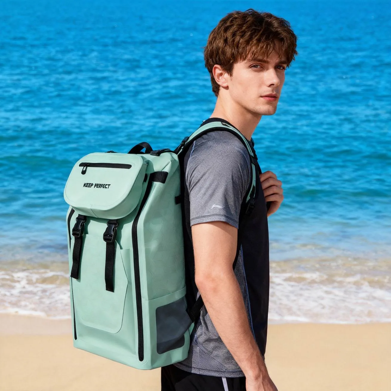 Blue dry bag backpack at the beach